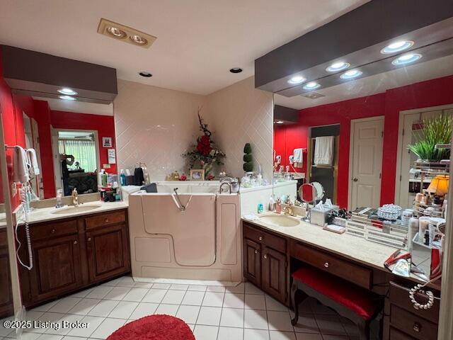 10606 Black Iron Rd, Louisville, KY 40291 - bathroom featuring tile patterned floors, a garden tub, vanity, and recessed lighting