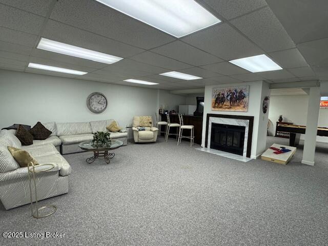 10606 Black Iron Rd, Louisville, KY 40291 - carpeted living area featuring a drop ceiling and a high end fireplace