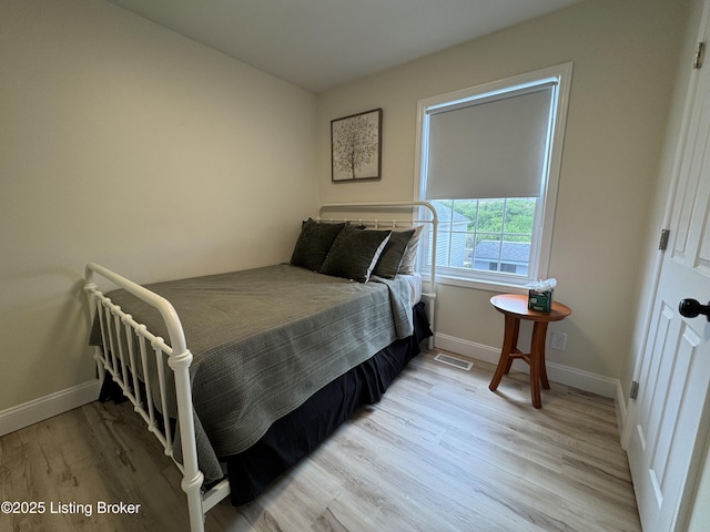 1254 S Preston St, Louisville, KY 40217 - bedroom featuring light wood-style floors and baseboards