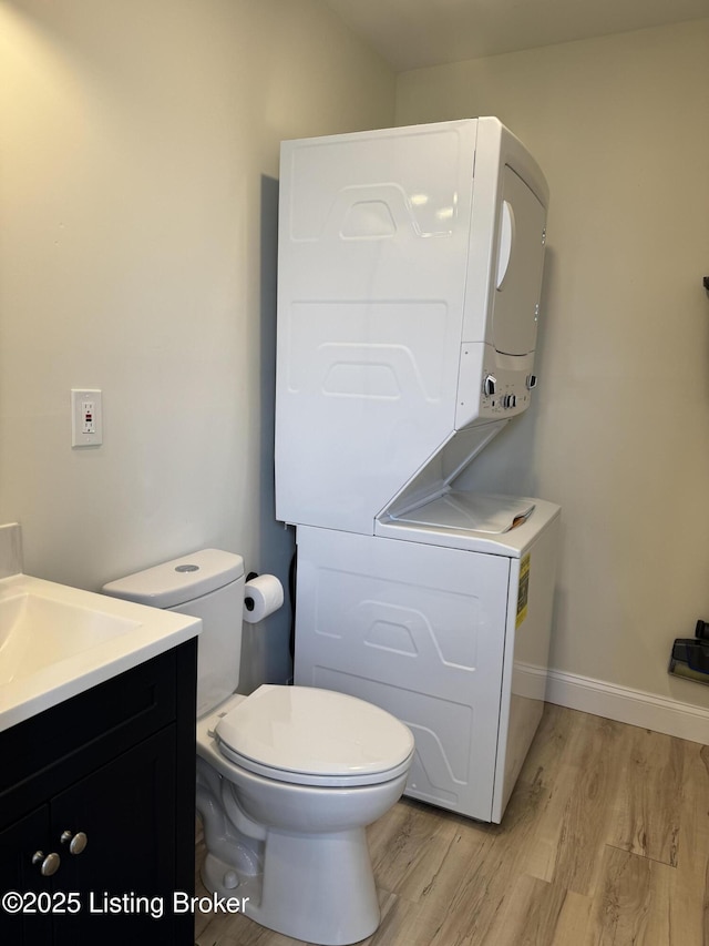 1254 S Preston St, Louisville, KY 40217 - bathroom with wood finished floors, vanity, toilet, and baseboards