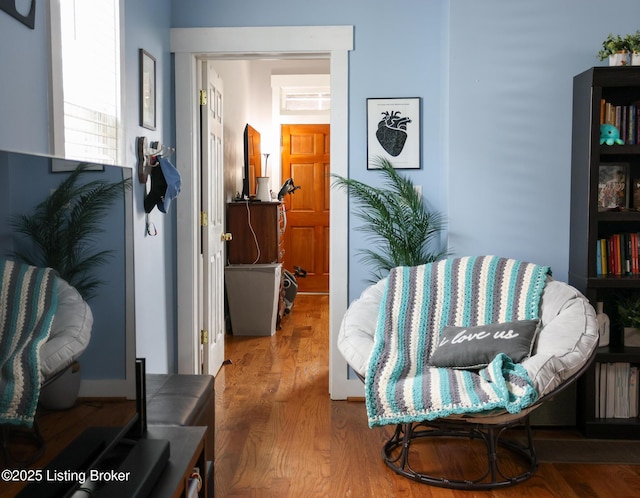 sitting room featuring wood finished floors