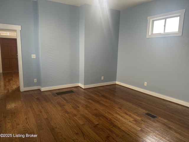 827 Mulberry St, Louisville, KY 40217 - unfurnished room with dark wood-style floors and baseboards