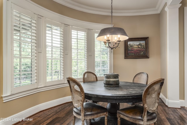 dining area with baseboards, dark wood-type flooring, healthy amount of natural light, and ornamental molding