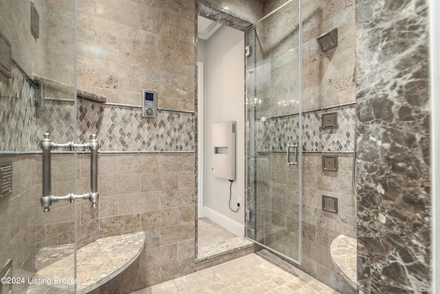 full bath featuring a stall shower and ornamental molding