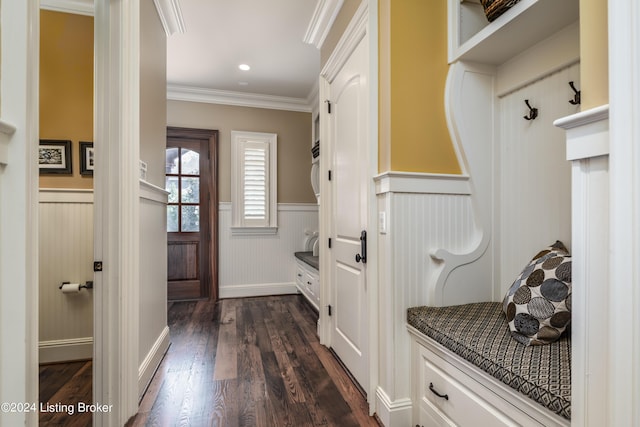 mudroom with a wainscoted wall, dark wood-style floors, and crown molding
