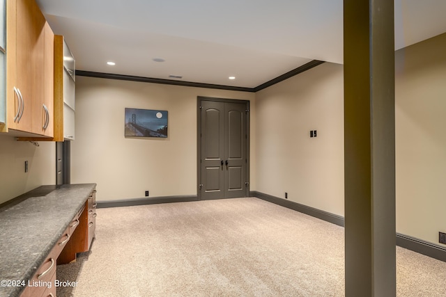 basement featuring ornamental molding, baseboards, carpet floors, and recessed lighting