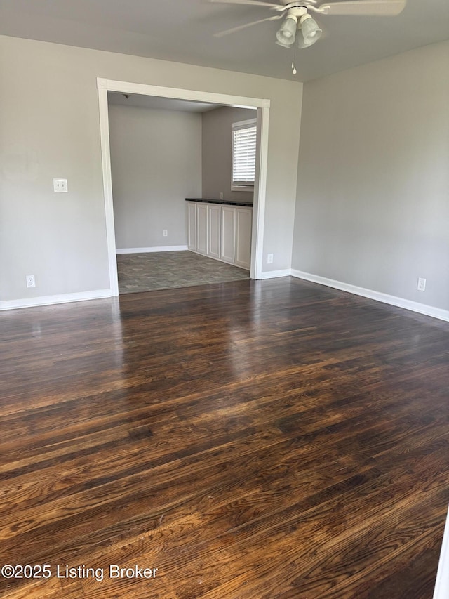 254 Greenbriar Ln, Louisville, KY 40229 - spare room featuring ceiling fan and dark wood-style floors
