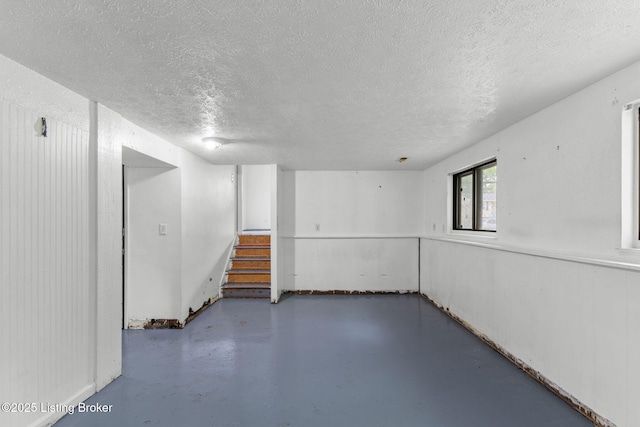 5113 Baywood Dr, Louisville, KY 40241 - below grade area featuring a textured ceiling and stairway