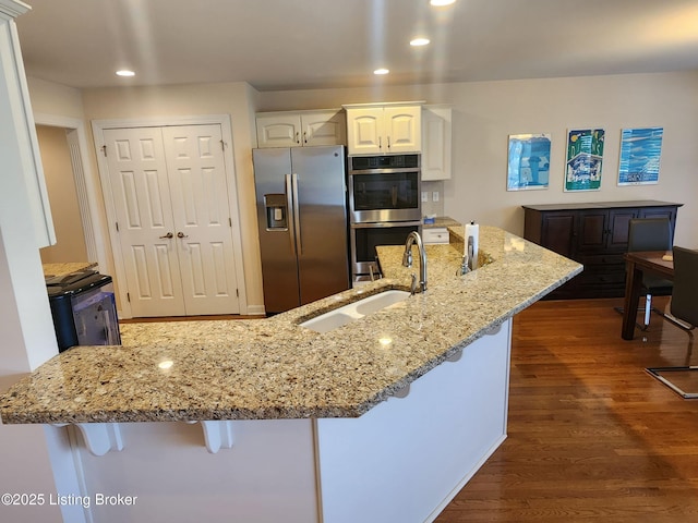 7201 Creekton Dr, Louisville, KY 40241 - kitchen with appliances with stainless steel finishes, a sink, white cabinetry, dark wood finished floors, and recessed lighting