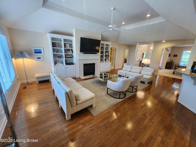 7201 Creekton Dr, Louisville, KY 40241 - living room featuring hardwood / wood-style floors, a ceiling fan, a raised ceiling, a tile fireplace, and recessed lighting