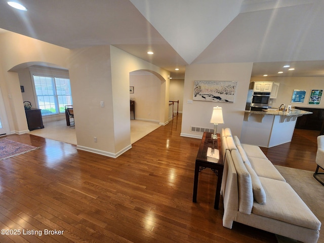 7201 Creekton Dr, Louisville, KY 40241 - corridor with arched walkways, hardwood / wood-style floors, recessed lighting, and lofted ceiling