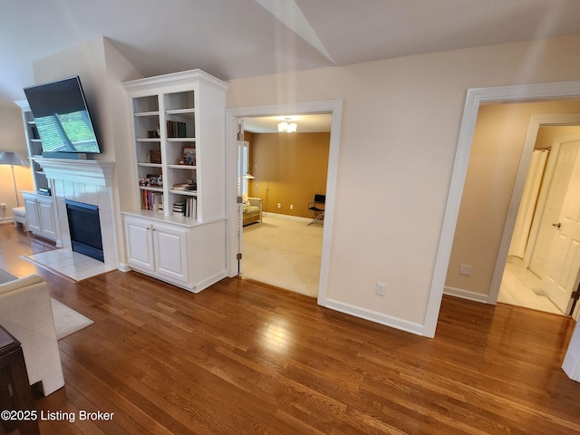 7201 Creekton Dr, Louisville, KY 40241 - unfurnished living room with hardwood / wood-style flooring, a tile fireplace, baseboards, and lofted ceiling
