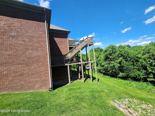 7201 Creekton Dr, Louisville, KY 40241 - view of home's exterior featuring stairway, a lawn, a deck, and brick siding