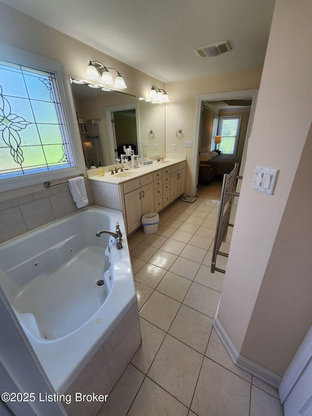 7201 Creekton Dr, Louisville, KY 40241 - ensuite bathroom featuring a whirlpool tub, a shower stall, double vanity, tile patterned floors, and baseboards