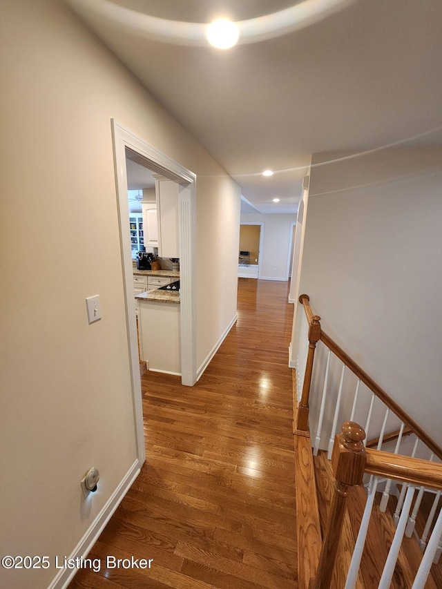 7201 Creekton Dr, Louisville, KY 40241 - hall with wood finished floors, an upstairs landing, and baseboards
