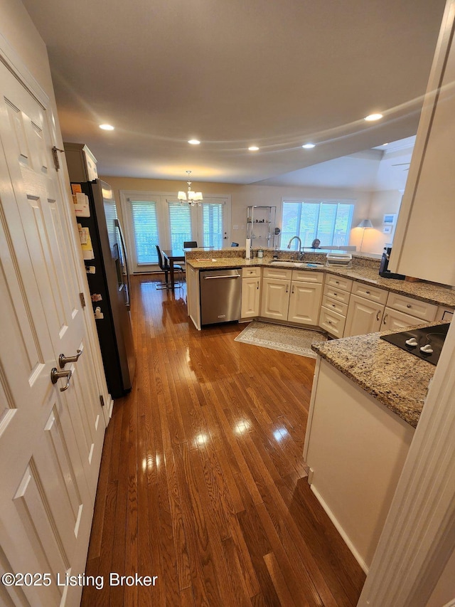7201 Creekton Dr, Louisville, KY 40241 - kitchen featuring appliances with stainless steel finishes, a sink, dark wood finished floors, a chandelier, and recessed lighting