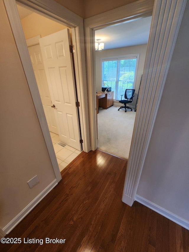 7201 Creekton Dr, Louisville, KY 40241 - hall with wood finished floors, a desk, and baseboards