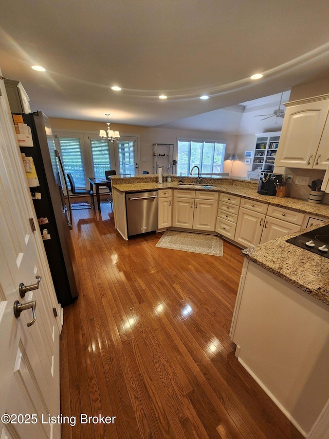 7201 Creekton Dr, Louisville, KY 40241 - kitchen featuring appliances with stainless steel finishes, a sink, dark wood finished floors, a chandelier, and recessed lighting