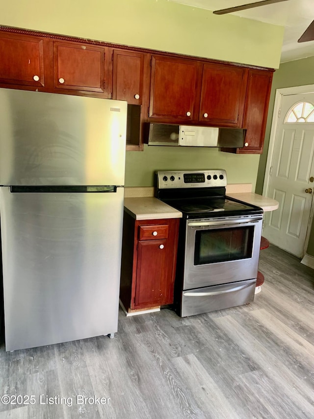 4727 Cliff Ave, Louisville, KY 40215 - kitchen featuring stainless steel appliances, light wood-style flooring, light countertops, and reddish brown cabinets