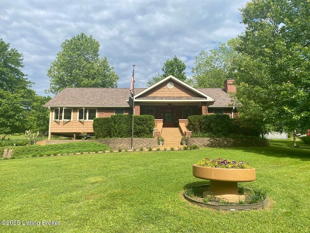 1222 Mountain View Rd, Falls Of Rough, KY 40119 - view of front of home with a front lawn, a chimney, and roof with shingles