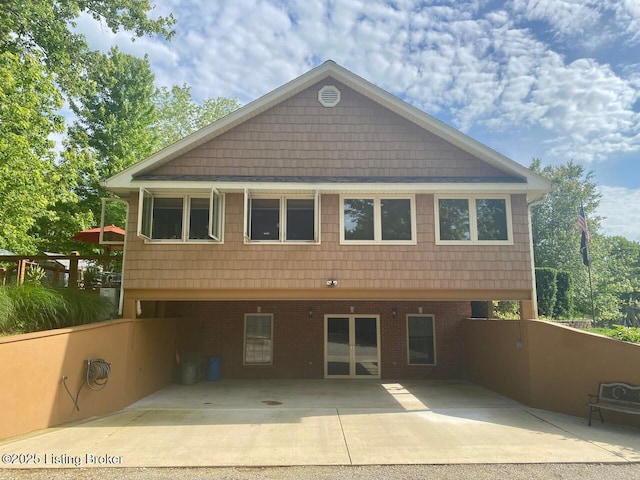 1222 Mountain View Rd, Falls Of Rough, KY 40119 - rear view of house featuring a carport, brick siding, and a patio