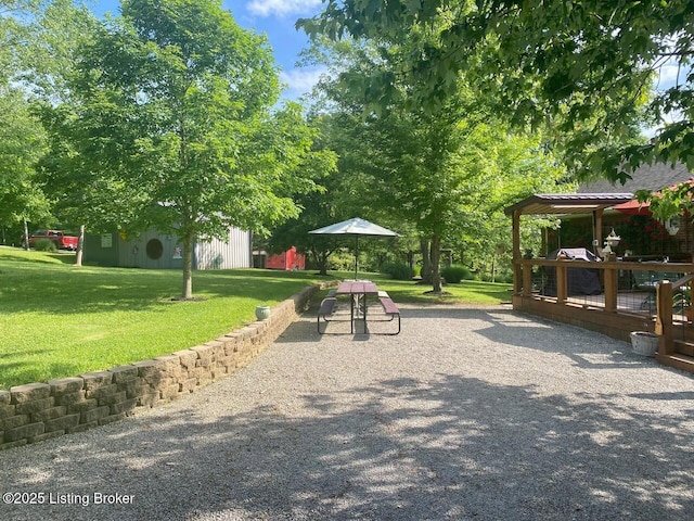 1222 Mountain View Rd, Falls Of Rough, KY 40119 - view of home's community with a yard, a deck, and an outdoor structure