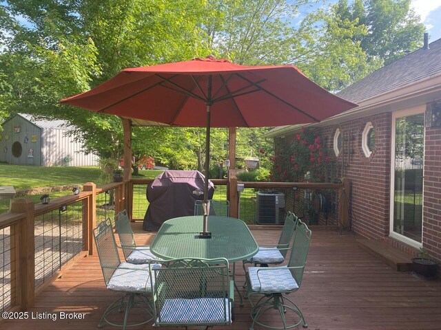 1222 Mountain View Rd, Falls Of Rough, KY 40119 - wooden deck with outdoor dining area, central AC unit, and an outdoor structure