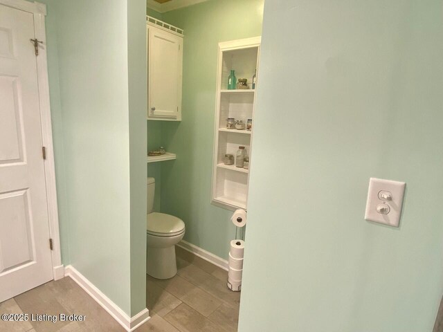 1222 Mountain View Rd, Falls Of Rough, KY 40119 - bathroom featuring toilet, baseboards, and tile patterned flooring