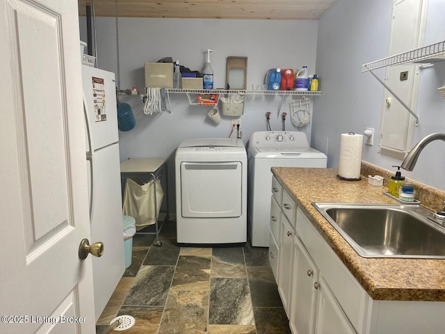 1222 Mountain View Rd, Falls Of Rough, KY 40119 - laundry area featuring independent washer and dryer and dark stone finish flooring