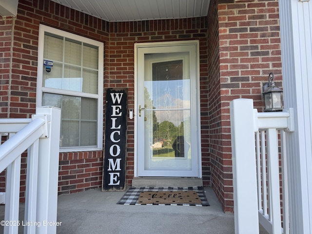 8005 Grandmeadow Ln, Louisville, KY 40258 - doorway to property with brick siding