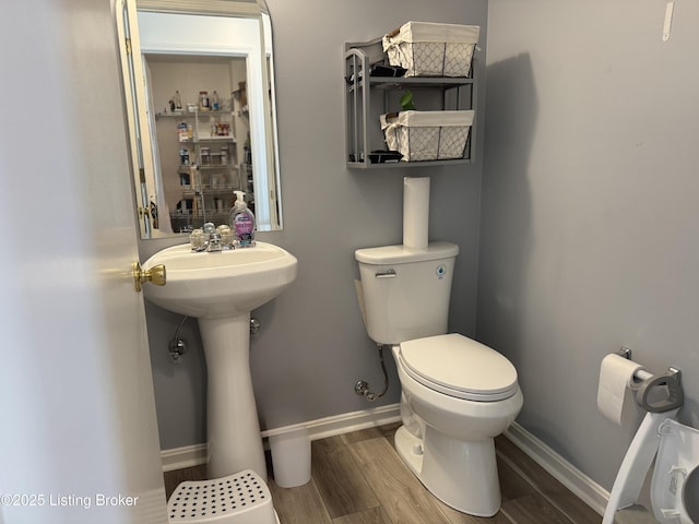 8005 Grandmeadow Ln, Louisville, KY 40258 - half bath with toilet, baseboards, and wood finished floors