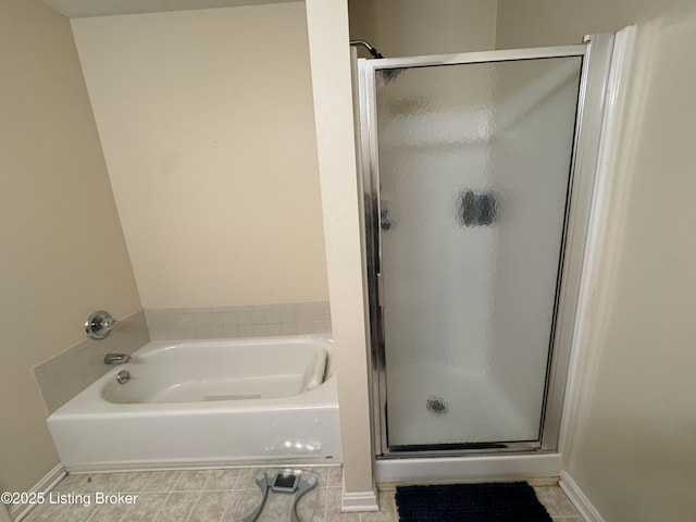 8005 Grandmeadow Ln, Louisville, KY 40258 - bathroom with a shower stall, a bath, baseboards, and tile patterned floors