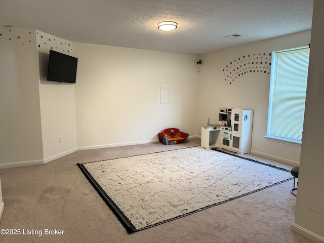 8005 Grandmeadow Ln, Louisville, KY 40258 - playroom featuring carpet, baseboards, and a textured ceiling