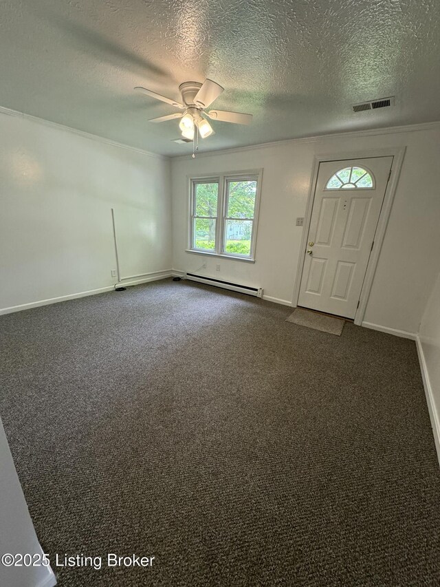 76 Bethel Church Rd, Brandenburg, KY 40108 - foyer featuring a baseboard radiator, a textured ceiling, ceiling fan, baseboards, and dark colored carpet