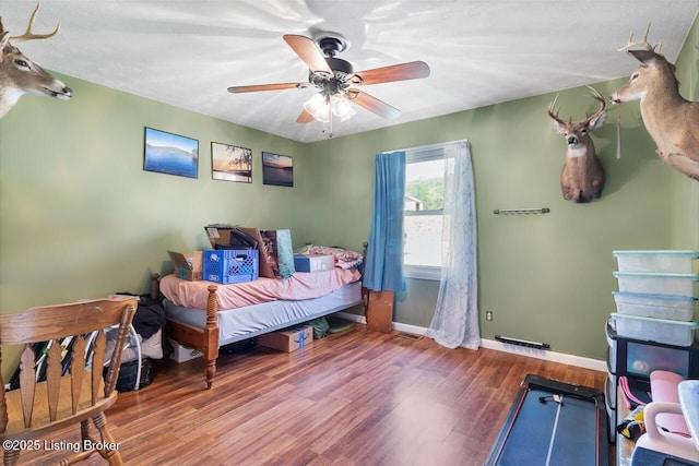 8887 New Haven Rd, New Haven, KY 40051 - bedroom with baseboards, wood finished floors, and a ceiling fan
