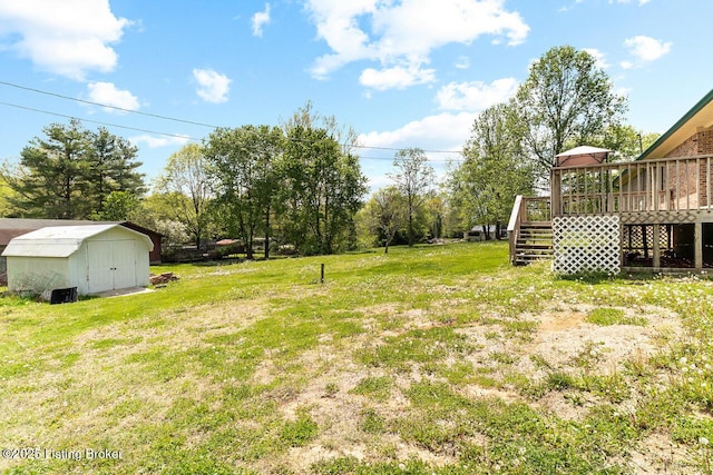 8887 New Haven Rd, New Haven, KY 40051 - view of grassy yard with a storage shed, a wooden deck, stairs, and an outdoor structure