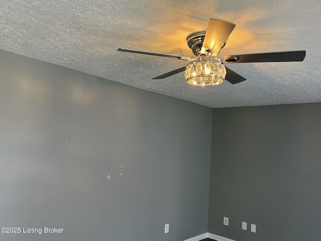 1644 Huntoon Ave, Louisville, KY 40215 - detailed view of a textured ceiling, ceiling fan, and baseboards