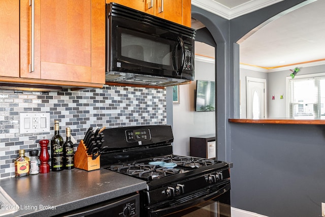 607 Penguin St, Louisville, KY 40217 - kitchen featuring black appliances, crown molding, arched walkways, decorative backsplash, and dark countertops