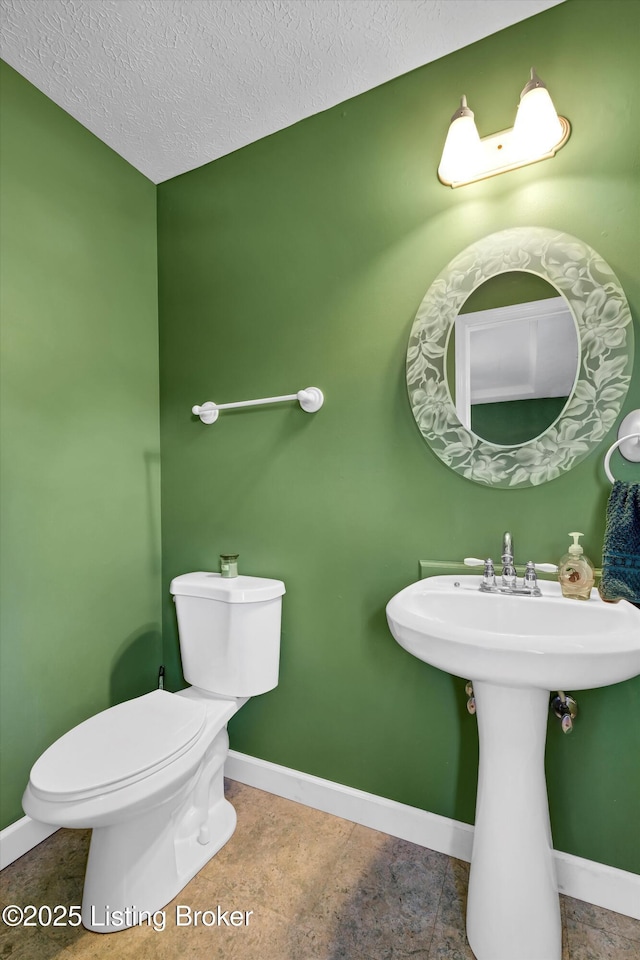 1401 Brooks Hill Rd, Brooks, KY 40109 - half bathroom featuring baseboards, toilet, a textured ceiling, tile patterned floors, and a sink