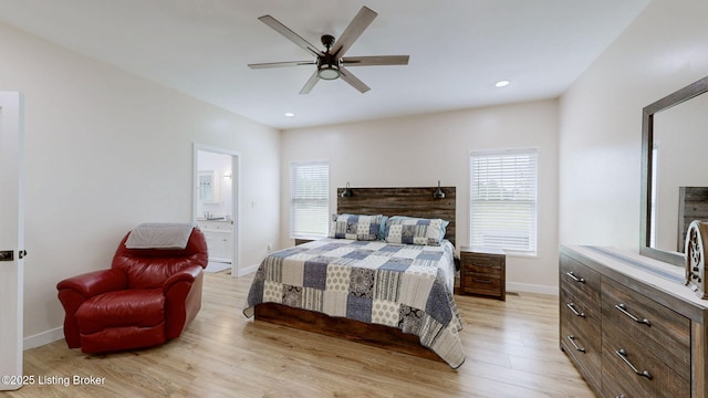 30 Bell Ct, Bedford, KY 40006 - bedroom with light wood finished floors, multiple windows, baseboards, recessed lighting, and connected bathroom