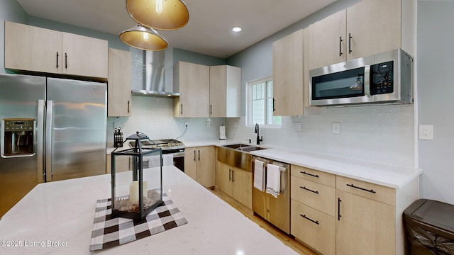30 Bell Ct, Bedford, KY 40006 - kitchen with stainless steel appliances, wall chimney range hood, light brown cabinetry, and a sink