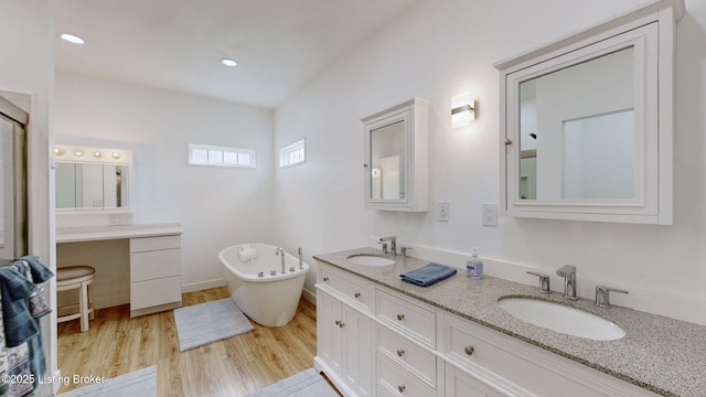 30 Bell Ct, Bedford, KY 40006 - full bathroom with a soaking tub, double vanity, wood finished floors, and recessed lighting
