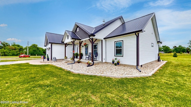 30 Bell Ct, Bedford, KY 40006 - view of front of house featuring covered porch, a front yard, and metal roof