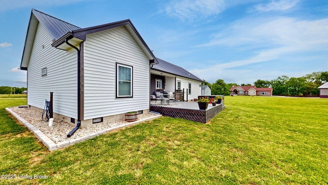 30 Bell Ct, Bedford, KY 40006 - back of property featuring metal roof, a lawn, and a patio area