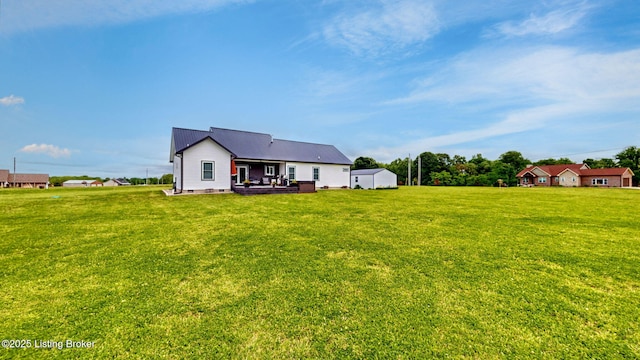 30 Bell Ct, Bedford, KY 40006 - back of property featuring a yard and metal roof