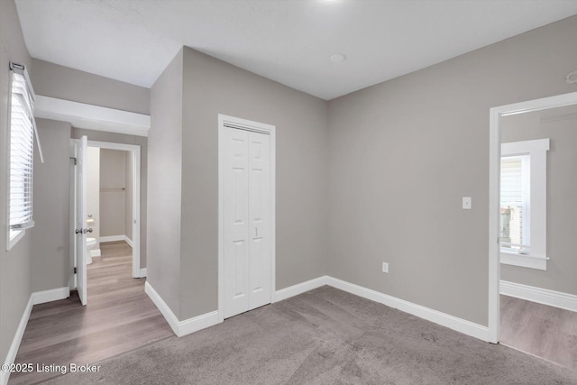 611 E Hill St, Louisville, KY 40217 - unfurnished room with wood finished floors and baseboards