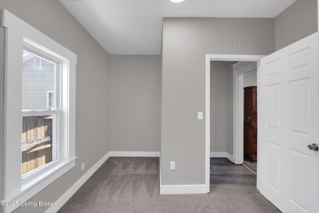 611 E Hill St, Louisville, KY 40217 - bonus room featuring plenty of natural light, carpet floors, and baseboards