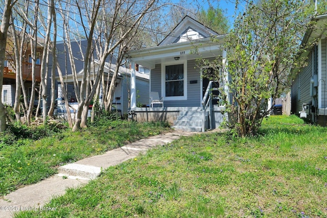 611 E Hill St, Louisville, KY 40217 - shotgun-style home with covered porch