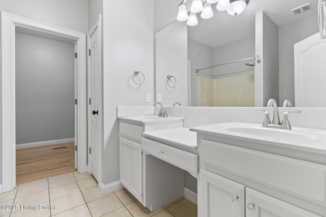 135 N Parkside Dr, Bardstown, KY 40004 - full bathroom featuring tile patterned floors, double vanity, and baseboards