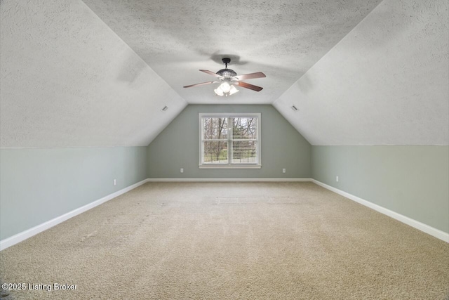 135 N Parkside Dr, Bardstown, KY 40004 - additional living space featuring a textured ceiling, baseboards, carpet, lofted ceiling, and a ceiling fan
